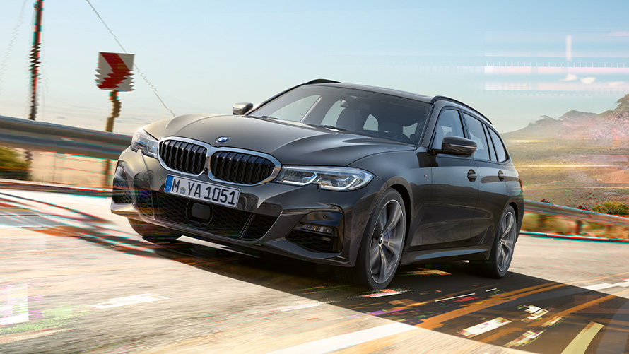 BMW serije 3 Touring (G21), barva Dravit Grey, tričetrtinski posnetek od spredaj BMW serije 3 Touring (G21), barva Dravit Grey, tričetrtinski posnetek od spredaj med vožnjo v podeželskem okolju