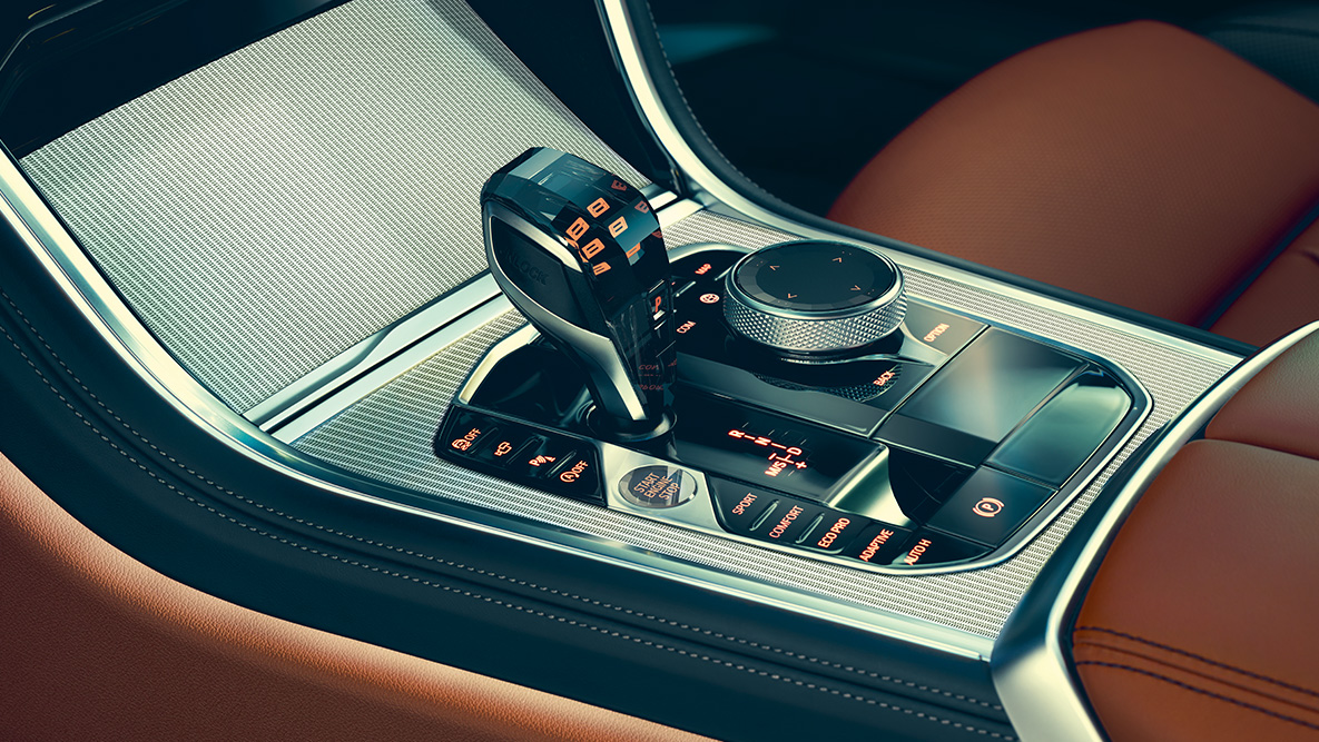BMW serije 8 Coupé, sredinska konzola. Pogled od blizu na notranjost BMW serije 8 Coupé s poudarkom na sredinski konzoli.
